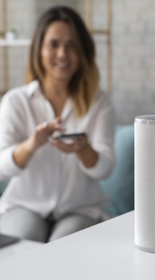 woman-using-speaker-digital-assistant woman-using-speaker-digital-assistant